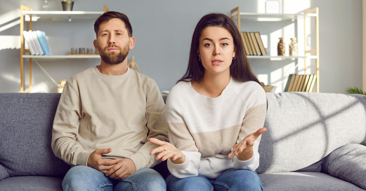 Couple sitting on couch having a discussion with the image viewer