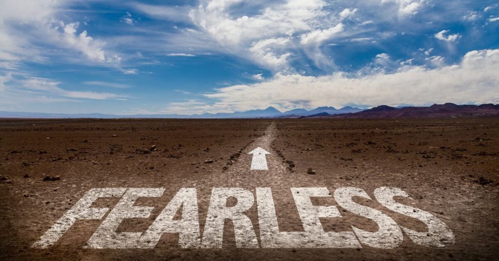 Tips for being fearless in a relationship | Desert photo with the word "Fearless" in the ground and an arrow pointing to a path