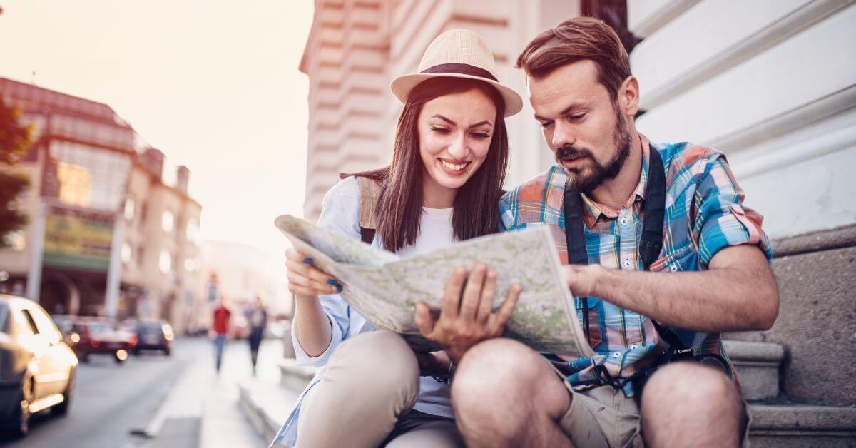 Couple using map to explore city