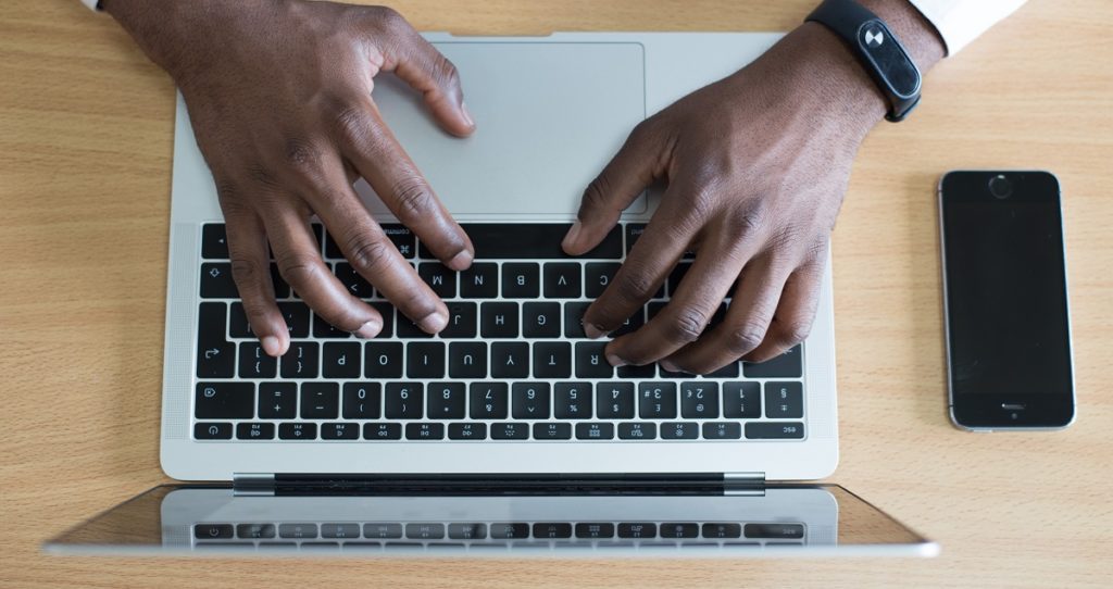 Man Typing on Computer