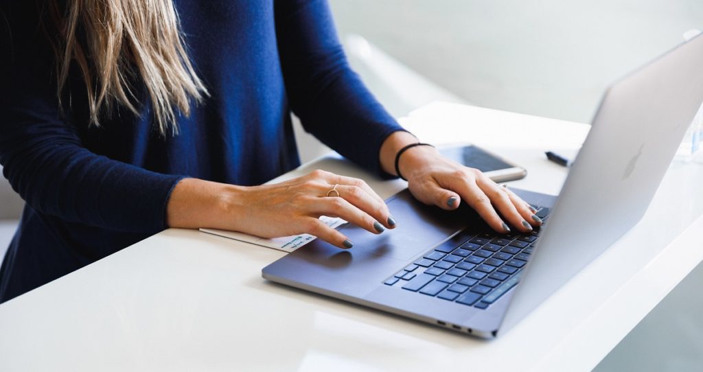Woman Typing Out Her Profile