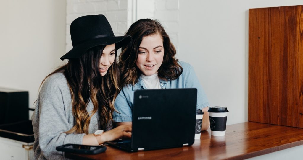 Girls Looking at Laptop Together