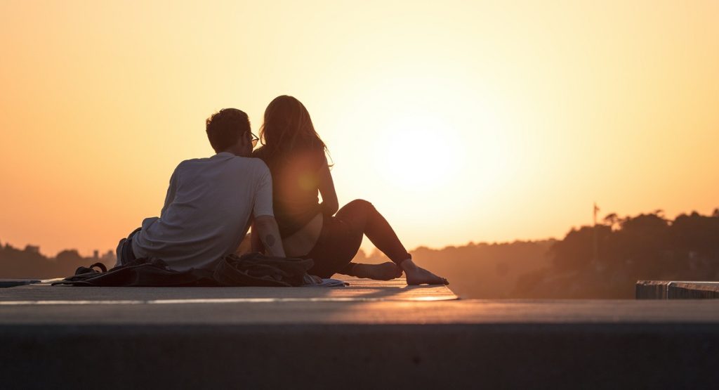 Couple Sitting and Watching Sunset