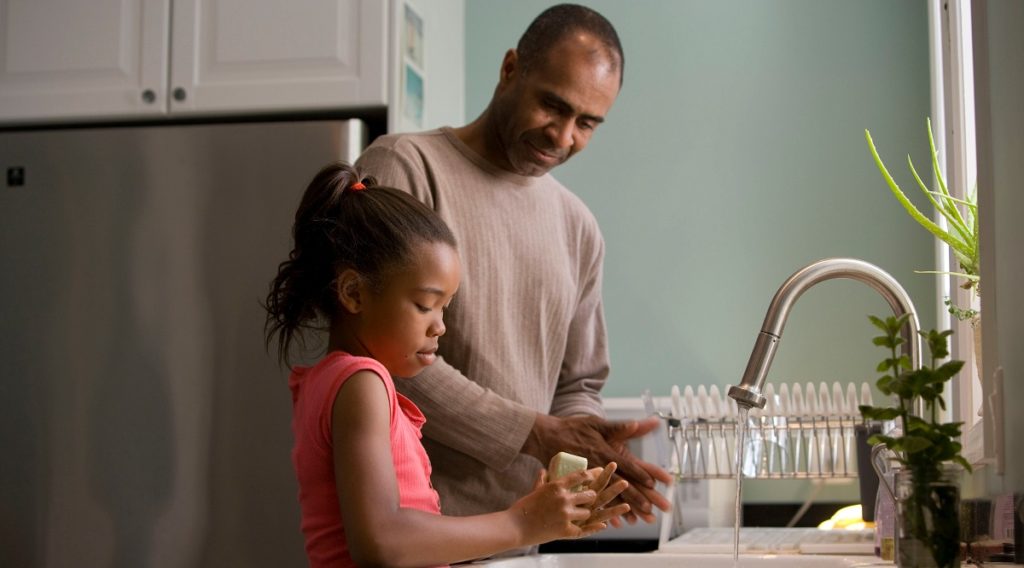 Single Dad Doing Dishes With His Daughter